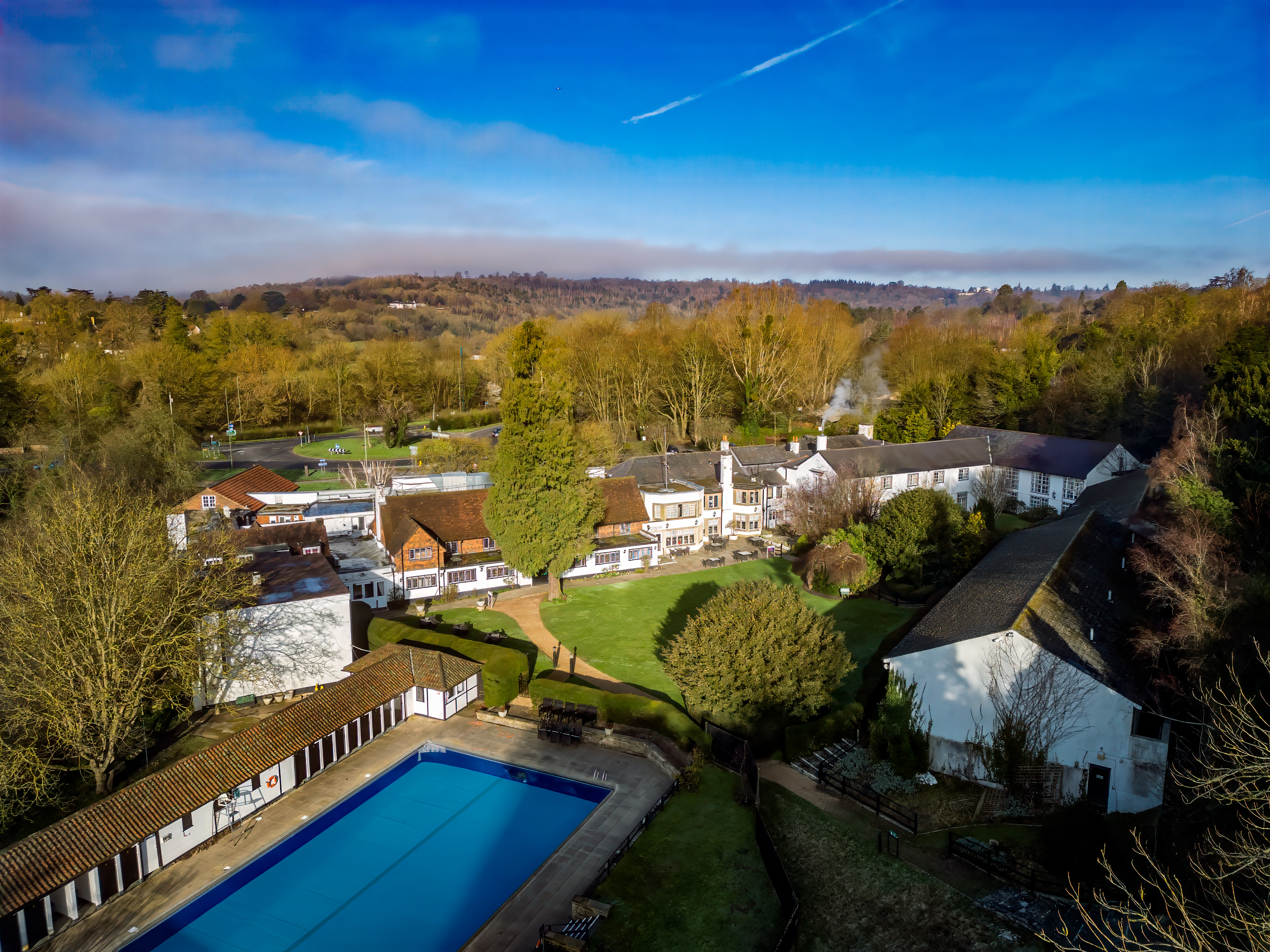 Exterior facade with lush greenery at Sunday Box Hill Burford Bridge Hotel